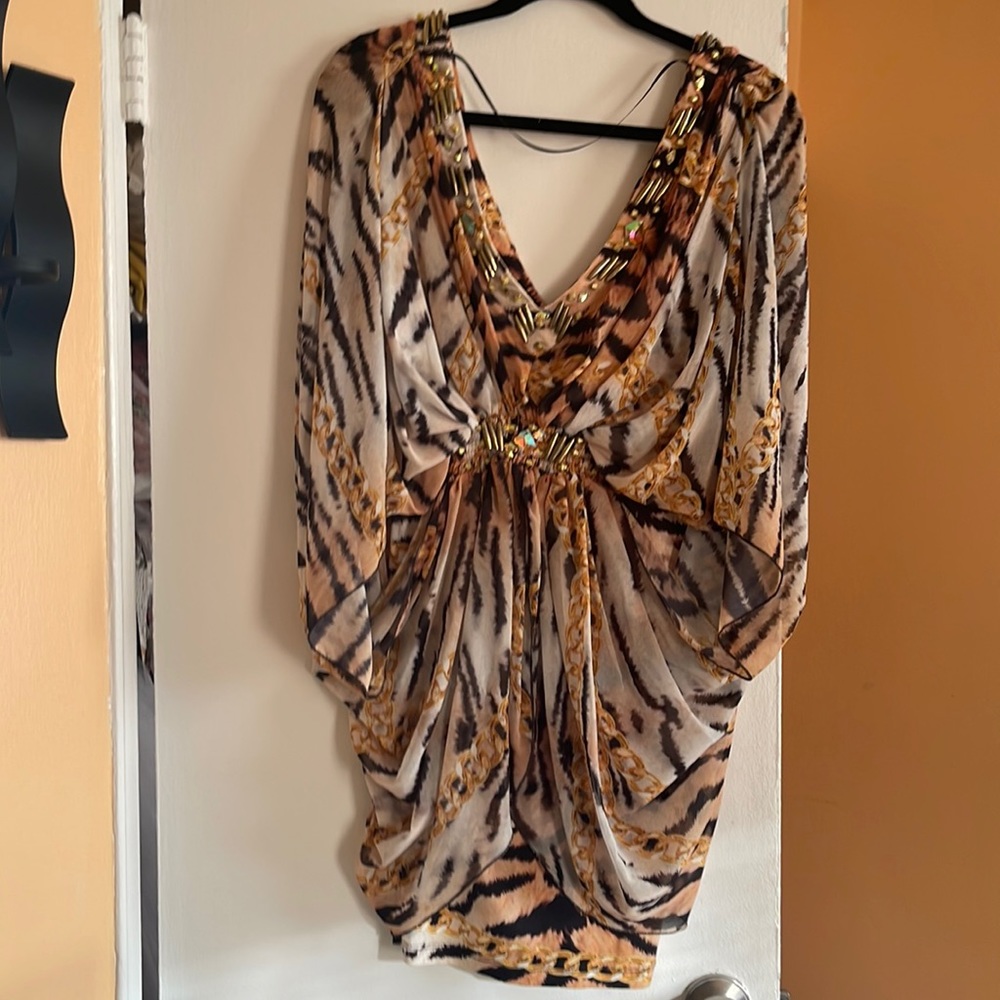 Selling a beautiful silk dress. Size M, brand- V @ K studio, animal print dress